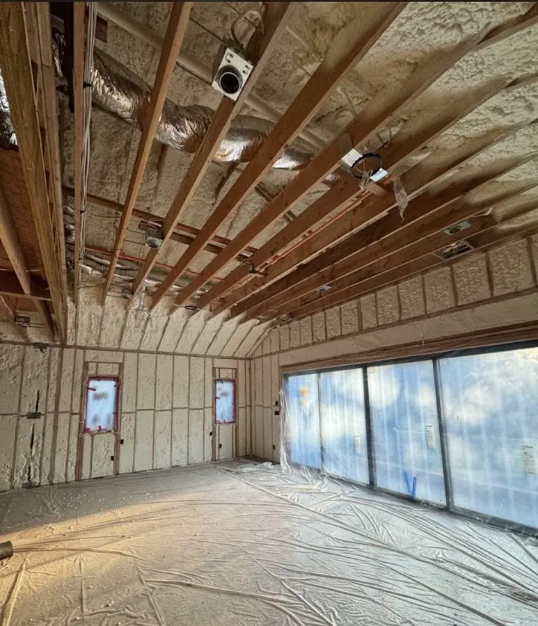 Interior walls and ceiling insulated with spray foam during new construction in Goshen